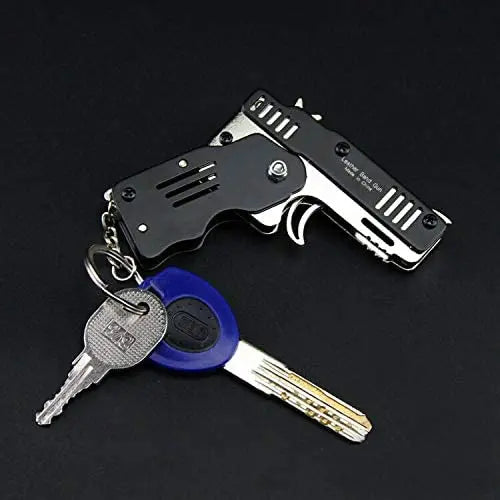 1PC Mini Toy Metal Gun with Rubber Band Fun Folding Pistol Key Charm Pendant Kids Birthday Gifts Toys Boy Girl Game Party Favors