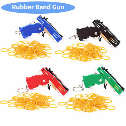 1PC Mini Toy Metal Gun with Rubber Band Fun Folding Pistol Key Charm Pendant Kids Birthday Gifts Toys Boy Girl Game Party Favors